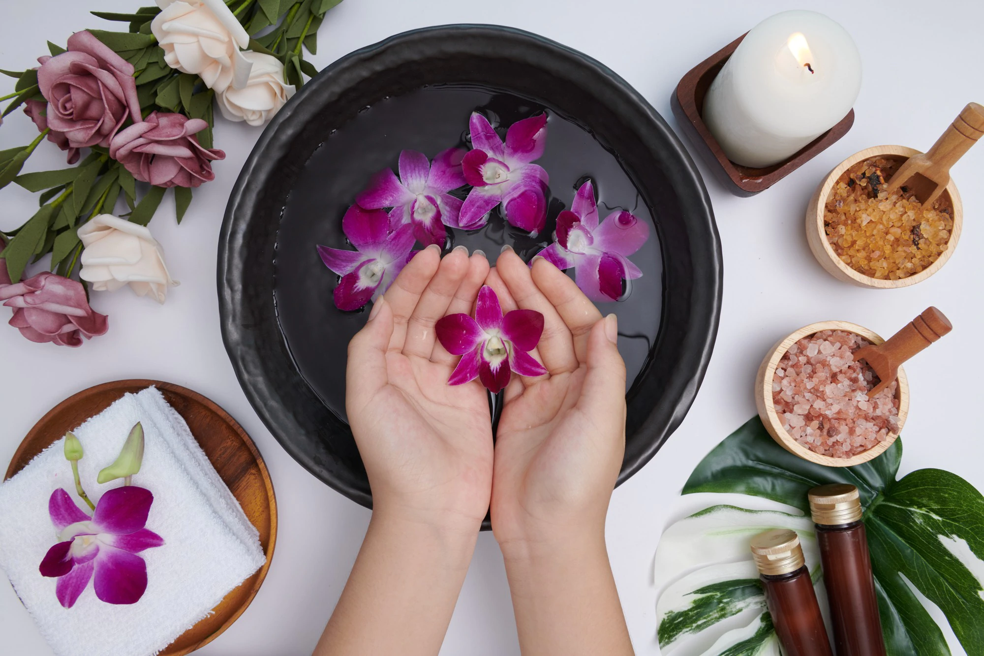 woman-soaking-her-hands-bowl-water-flowers-spa-treatment-product-female-feet-hand-spa-massage-pebble-perfumed-flowers-water-candles-relaxation-flat-lay-top-view_1150-44589